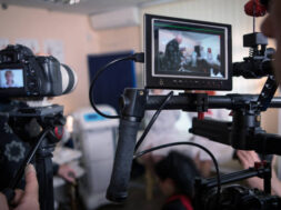 Video cameras on the set, backstage of the movie scene, operator hands