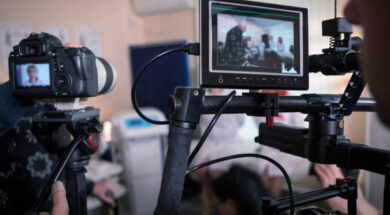 Video cameras on the set, backstage of the movie scene, operator hands
