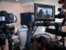 Video cameras on the set, backstage of the movie scene, operator hands